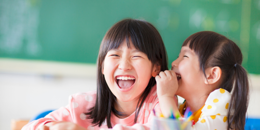Children laughing at humor in the classroom